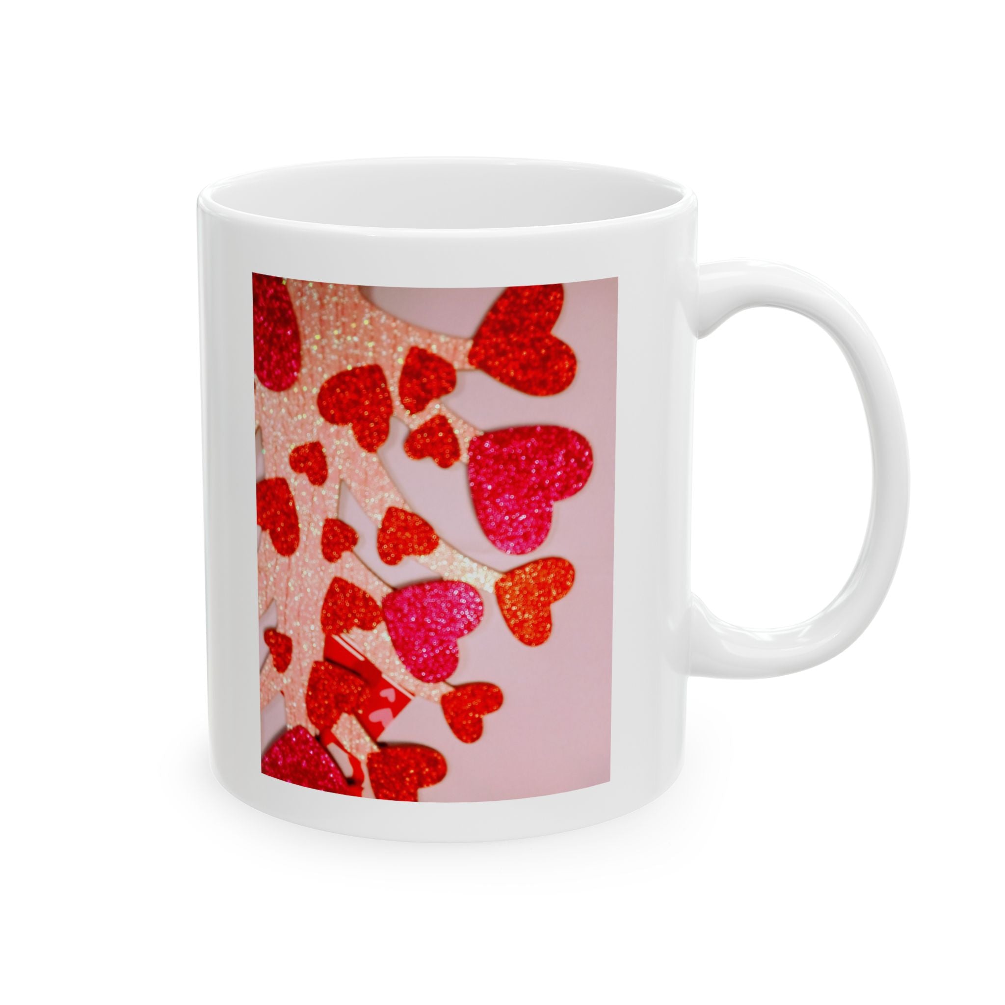 White mug with a design of red hearts on a pink background