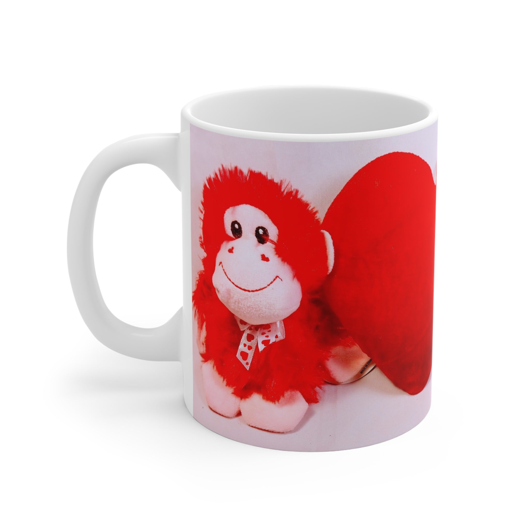 White mug with a red monkey design on a white background